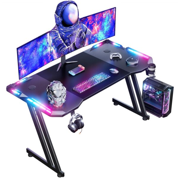 Was: £69.99 Now Only £54.99 DLONGONE 120 x 60cm RGB Gaming Desk, Large Gaming Table for Laptop, Home Office Desk with Carbon Fiber Coated, Gaming PC Desk with Headphone Hook and Cup Holder, Easy to Assemble, Black